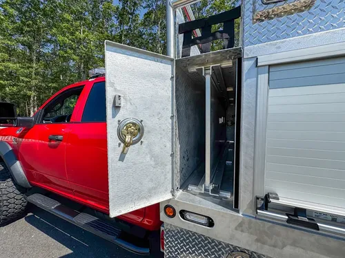 Open long side storage door with full-length shelf bay exposed.